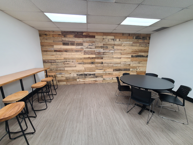 Finished DIY pallet wall built from reclaimed pallet boards
